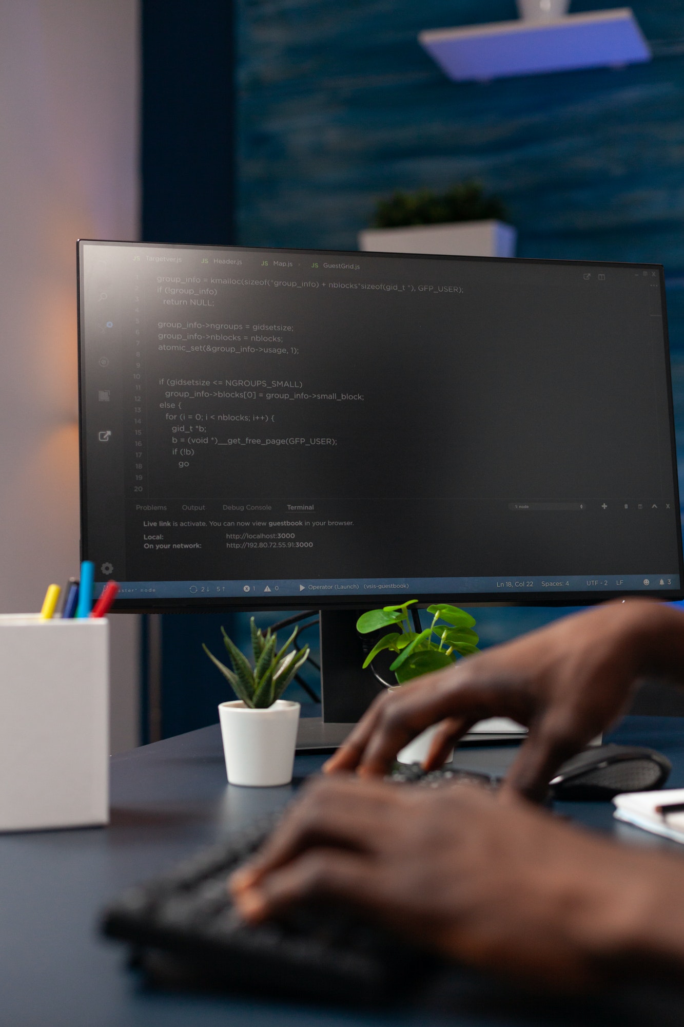 Closeup of programmer man hand typing website script on computer