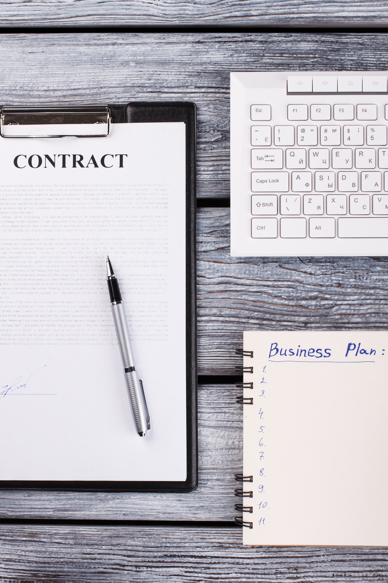 Signed contract with pen.