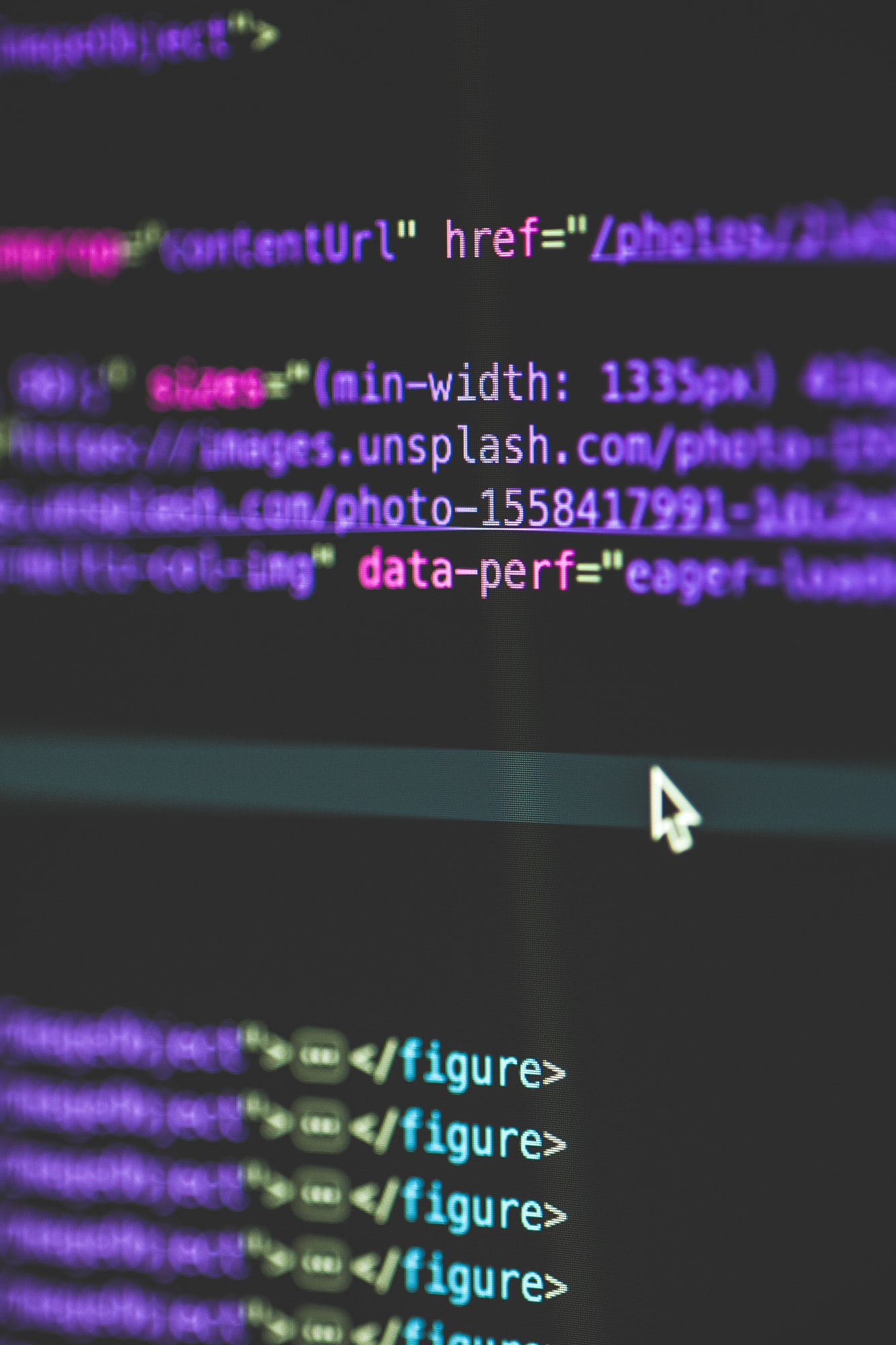 Vertical selective closeup shot of data codes on a computer monitor screen
